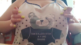 Young student with big tits excites her big nipples . Close-up