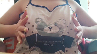 Young student with big tits excites her big nipples . Close-up