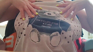 Young student with big tits excites her big nipples . Close-up