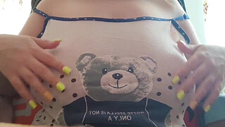 Young student with big tits excites her big nipples . Close-up