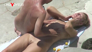 Beach Voyeur. Naughty young couple quick fuck on a rocky beach