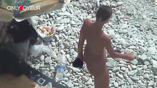 Beach Voyeur. Hot babe posing at the beach totally naked and with buttplug in her ass