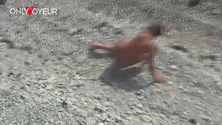 Beach Voyeur. Hot babe posing at the beach totally naked and with buttplug in her ass