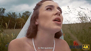 BRIDE4K. Pretty brunette bride fucks a horny shepherd in a summer field