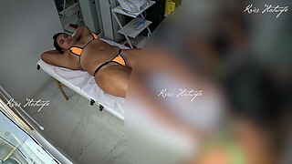 Giving a massage with a micro bikini stuffed in her pussy