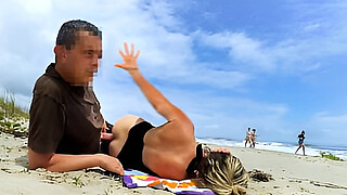 A fat dick in the ass perked up a milf dozing on the beach!