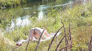 Nude Milf sunbathing on river bank. Random guy watching and filmed on his smartphone. Wild beach. Naked in public. Nudist beach. Doggystyle. Ass. Pussy. Doggy style. POV. Outdoor. Outside. Publicly. Ass milf. Butt. In nature. Without panties. No panties