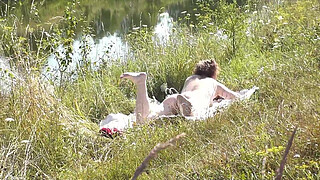 Nude Milf sunbathing on river bank. Random guy watching and filmed on his smartphone. Wild beach. Naked in public. Nudist beach. Doggystyle. Ass. Pussy. Doggy style. POV. Outdoor. Outside. Publicly. Ass milf. Butt. In nature. Without panties. No panties