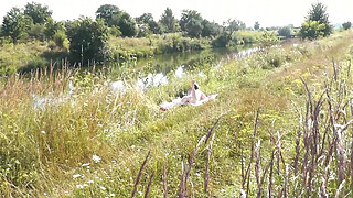 Nude Milf sunbathing on river bank. Random guy watching and filmed on his smartphone. Wild beach. Naked in public. Nudist beach. Doggystyle. Ass. Pussy. Doggy style. POV. Outdoor. Outside. Publicly. Ass milf. Butt. In nature. Without panties. No panties