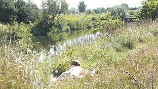 Nude Milf sunbathing on river bank. Random guy watching and filmed on his smartphone. Wild beach. Naked in public. Nudist beach. Doggystyle. Ass. Pussy. Doggy style. POV. Outdoor. Outside. Publicly. Ass milf. Butt. In nature. Without panties. No panties