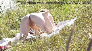 Nude Milf sunbathing on river bank. Random guy watching and filmed on his smartphone. Wild beach. Naked in public. Nudist beach. Doggystyle. Ass. Pussy. Doggy style. POV. Outdoor. Outside. Publicly. Ass milf. Butt. In nature. Without panties. No panties