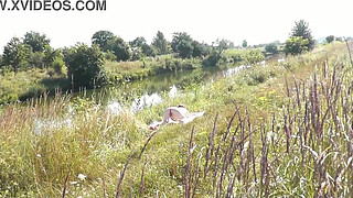 Nude Milf sunbathing on river bank. Random guy watching and filmed on his smartphone. Wild beach. Naked in public. Nudist beach. Doggystyle. Ass. Pussy. Doggy style. POV. Outdoor. Outside. Publicly. Ass milf. Butt. In nature. Without panties. No panties