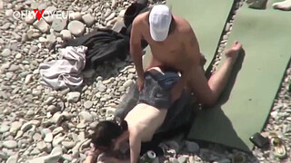 Beach Voyeur. Unashamed nudists having sex on the beach right near others