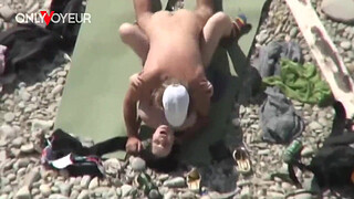 Beach Voyeur. Unashamed nudists having sex on the beach right near others