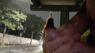 Risky handjob on the street for hot redhead at the bus stop