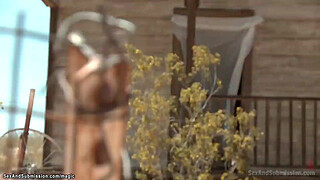 Hunter tormets slaves in the desert