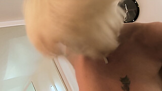 Sexy blonde milf Tia Lane is dressed up in black stockings and fucking hard in a black armchair.