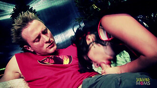 The horny dude receives fellatio by a cock hungry brunette with big tits