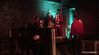 The blonde and brunette milfs with fake boobs have group sex in the creepy basement